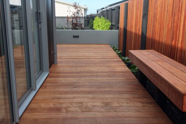 Outdoor decking with timber garden edging and exposed aggregate concrete