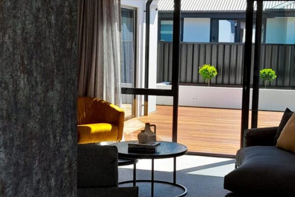Timber decking and garden landscaping viewed from indoors