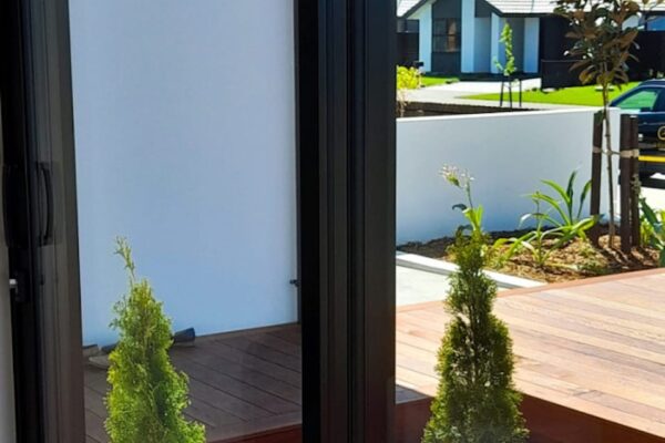 Outdoor decking with garden planting in Rolleston